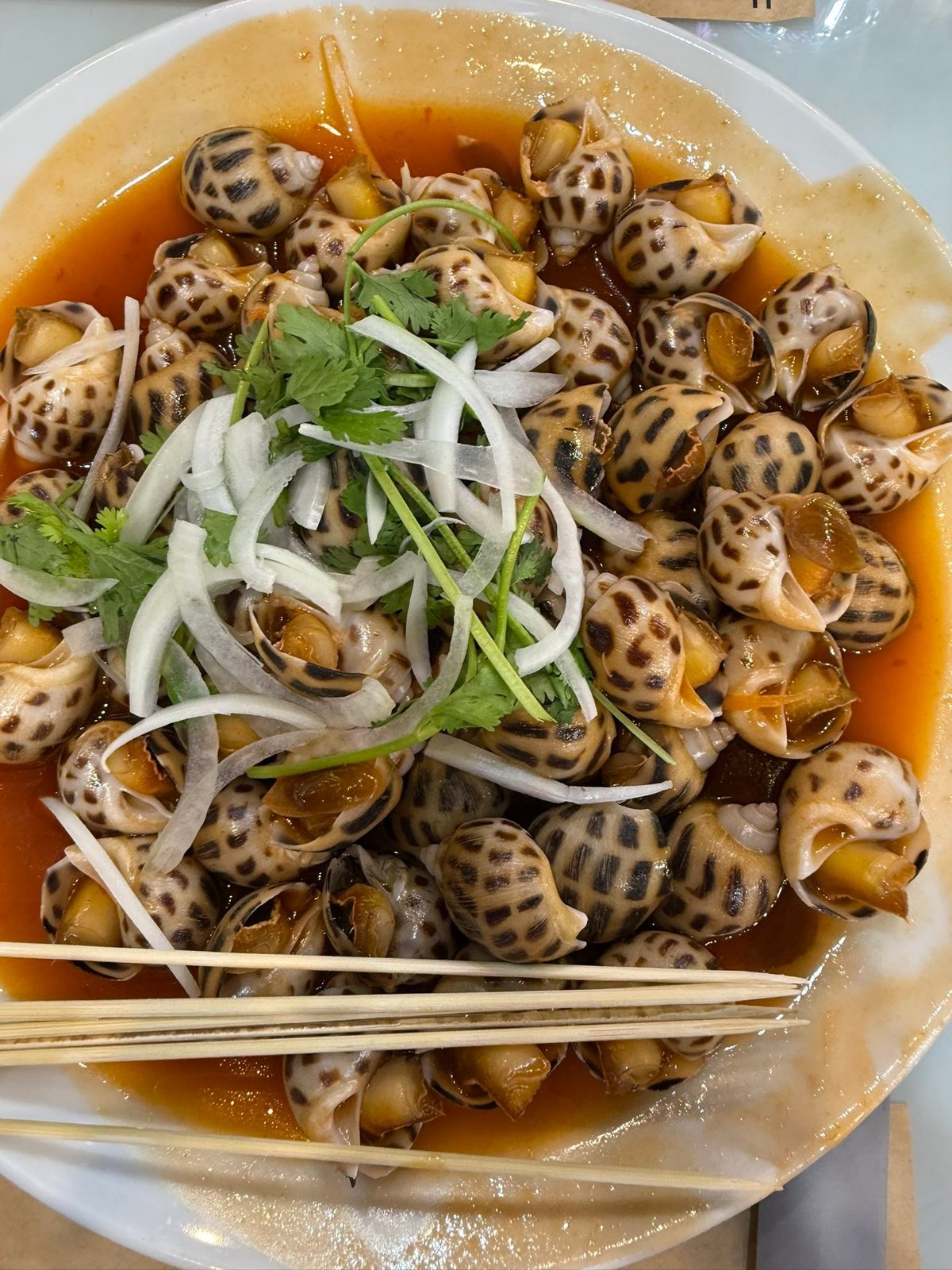 Sea snails in a sweet tomato broth.