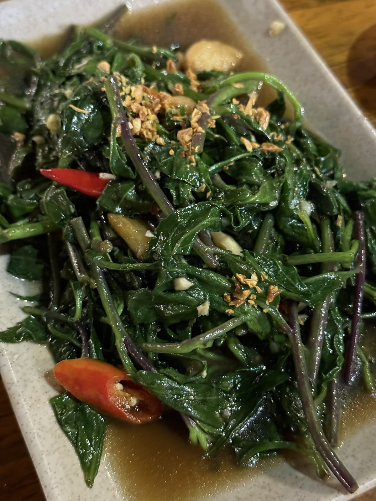 Rau muống with fried garlic.