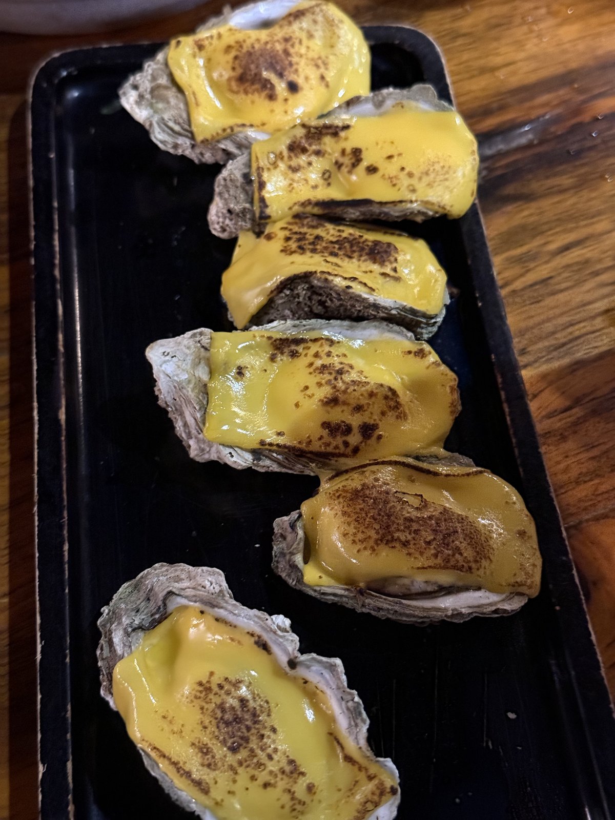 Broiled oysters, American cheese.