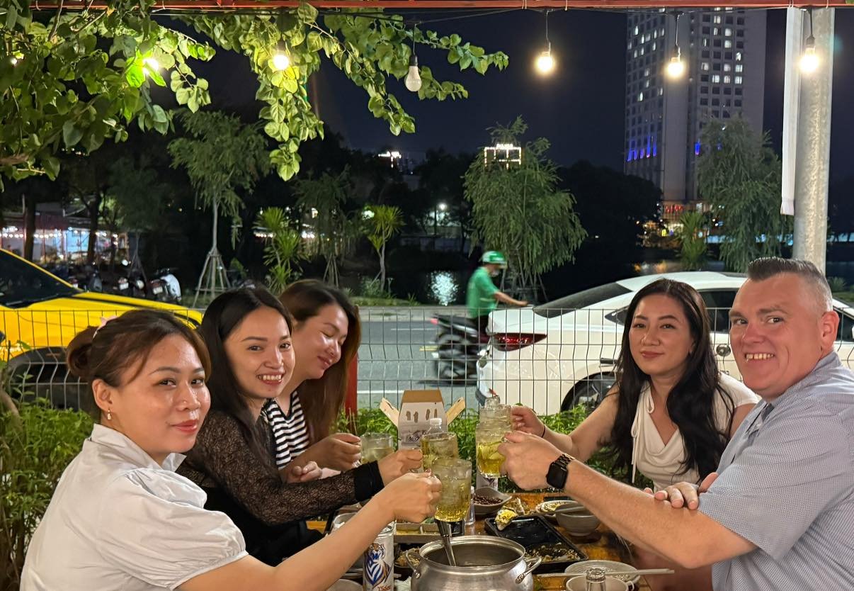 Cheers, by the river.
