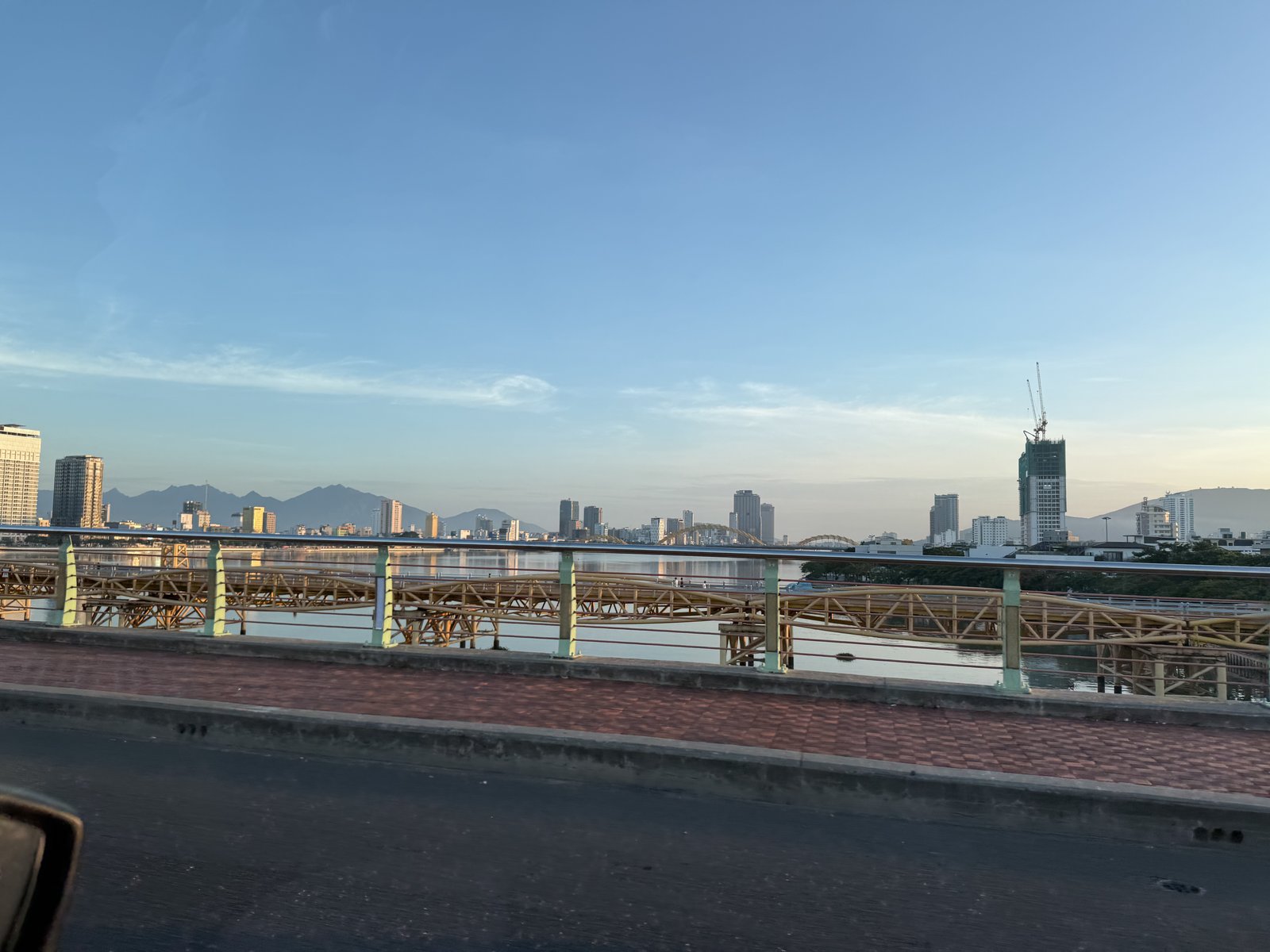 The city across the river, on the way to the airport.