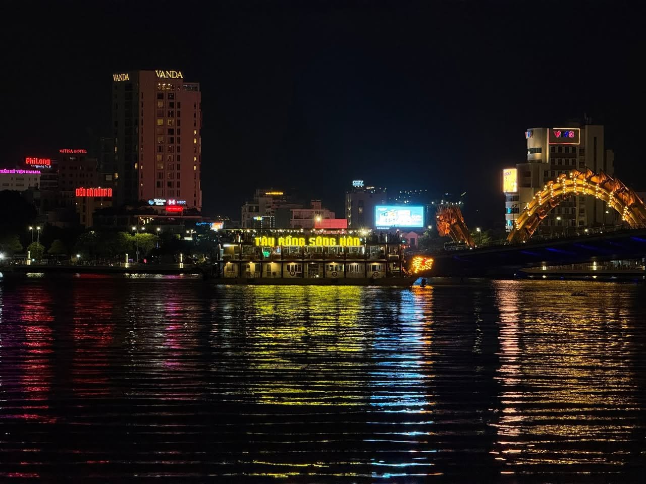 The Hàn River at night, the Dragon Bridge at right.