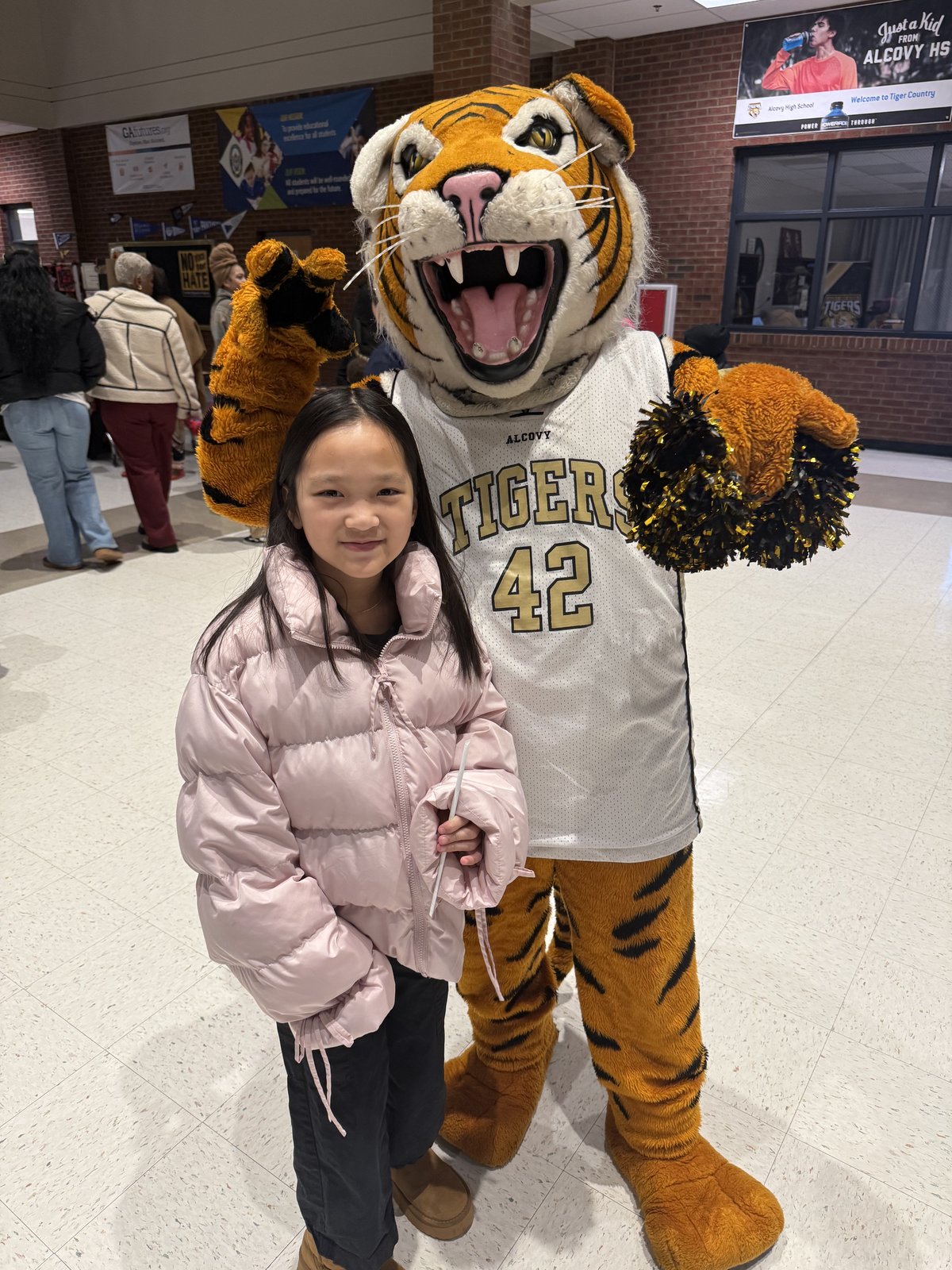 Jennie and a tiger, this past winter. Middle school is next.