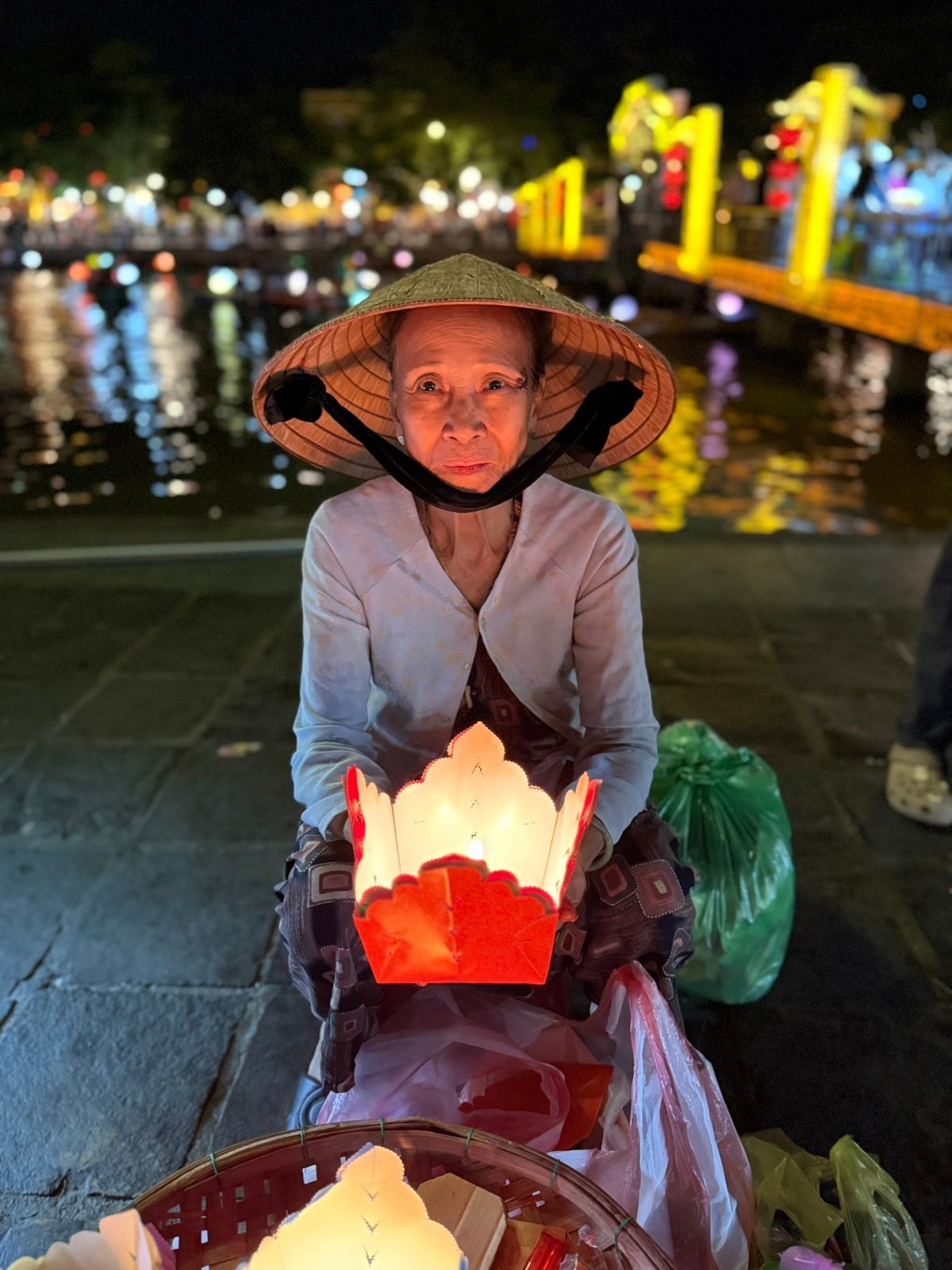 She came to the water's edge with her candles.