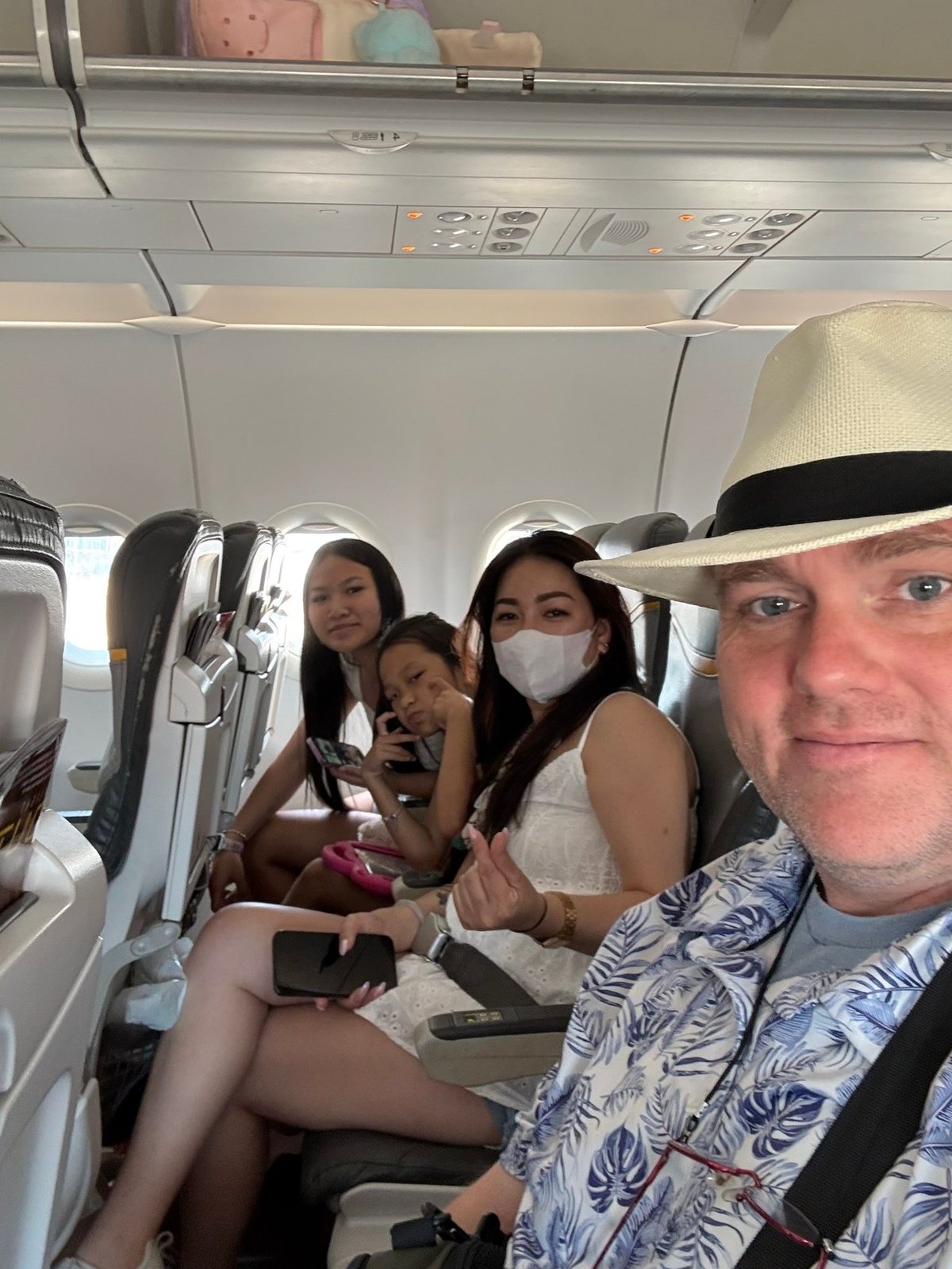 Seat selfie, hat on.