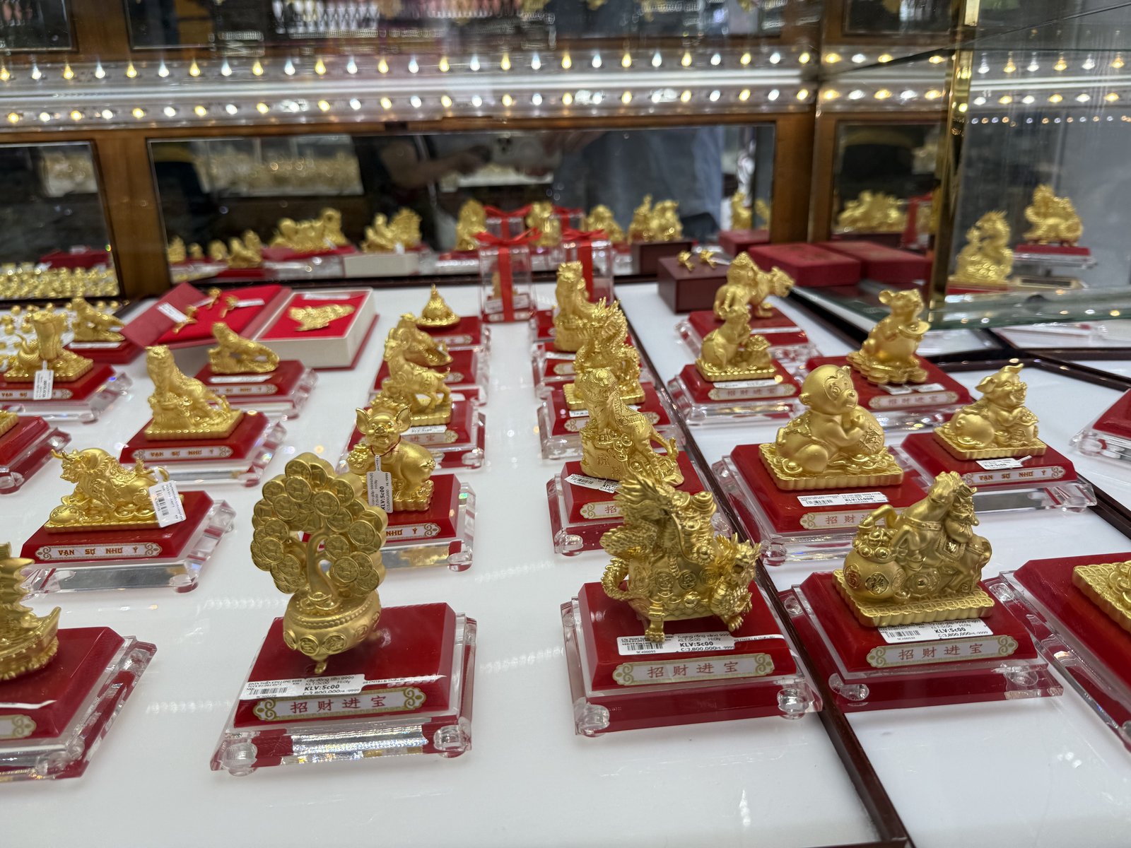Gold, by the figurine.