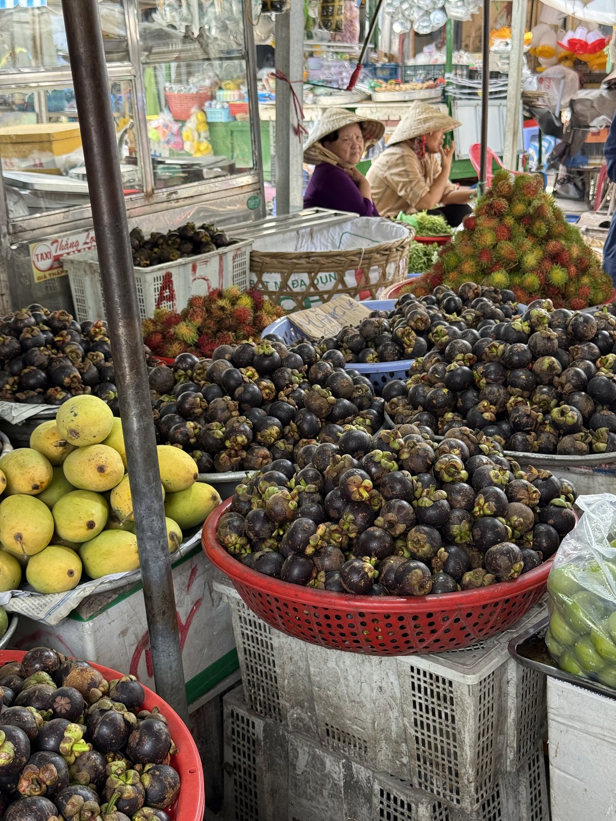 Mangosteens, rambutans and mangoes in the market lanes.