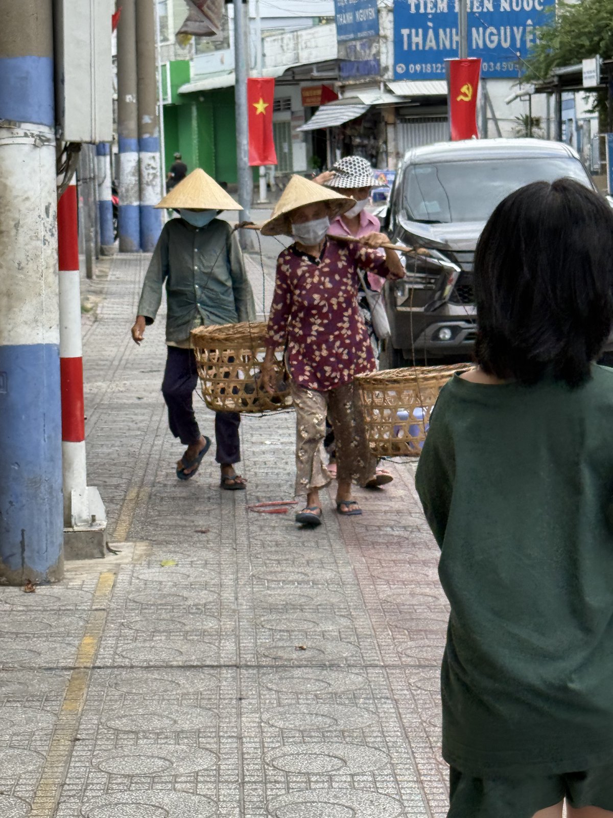 Two women with their baskets, after lunch.