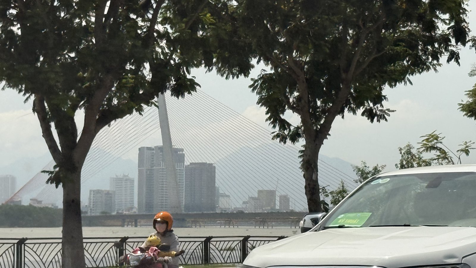 The city across the river, minutes from the old neighborhood.
