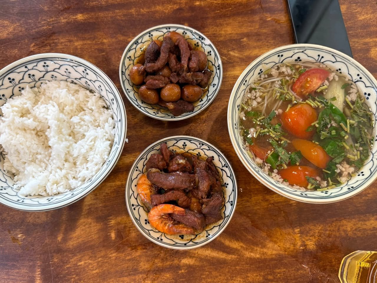 Rice, canh chua, the caramelized pork, and the shrimp.